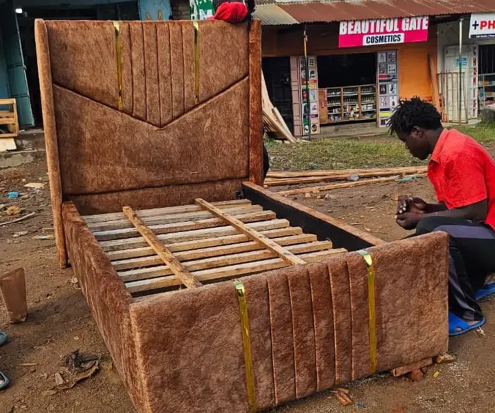 Plushfully upholstered wooden bed frame