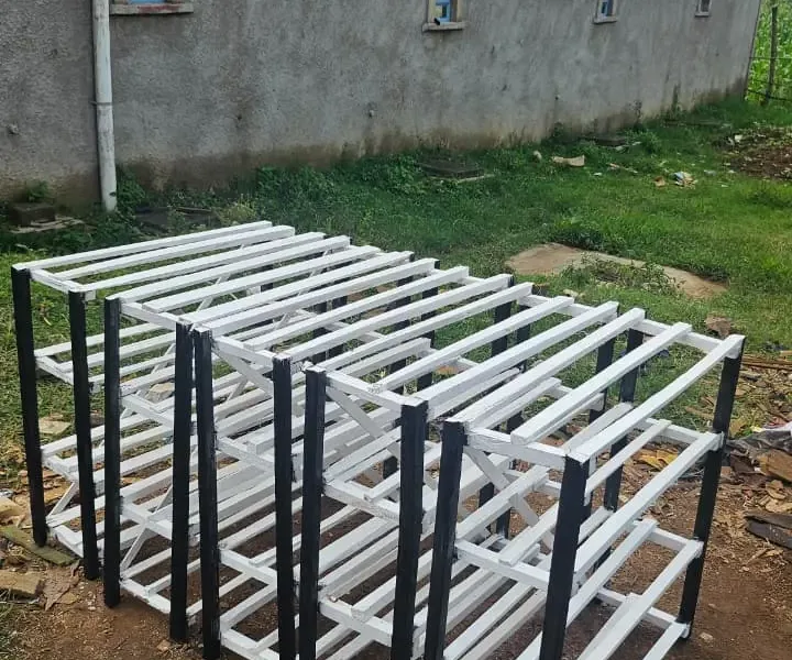 Multi-tier black and white painted wooden shoe racks