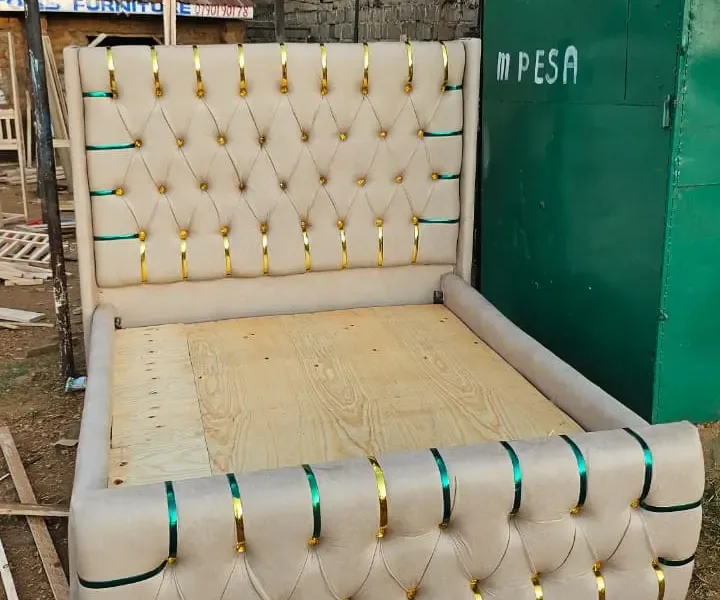 Upholstered cream / off-white tufted bed frame